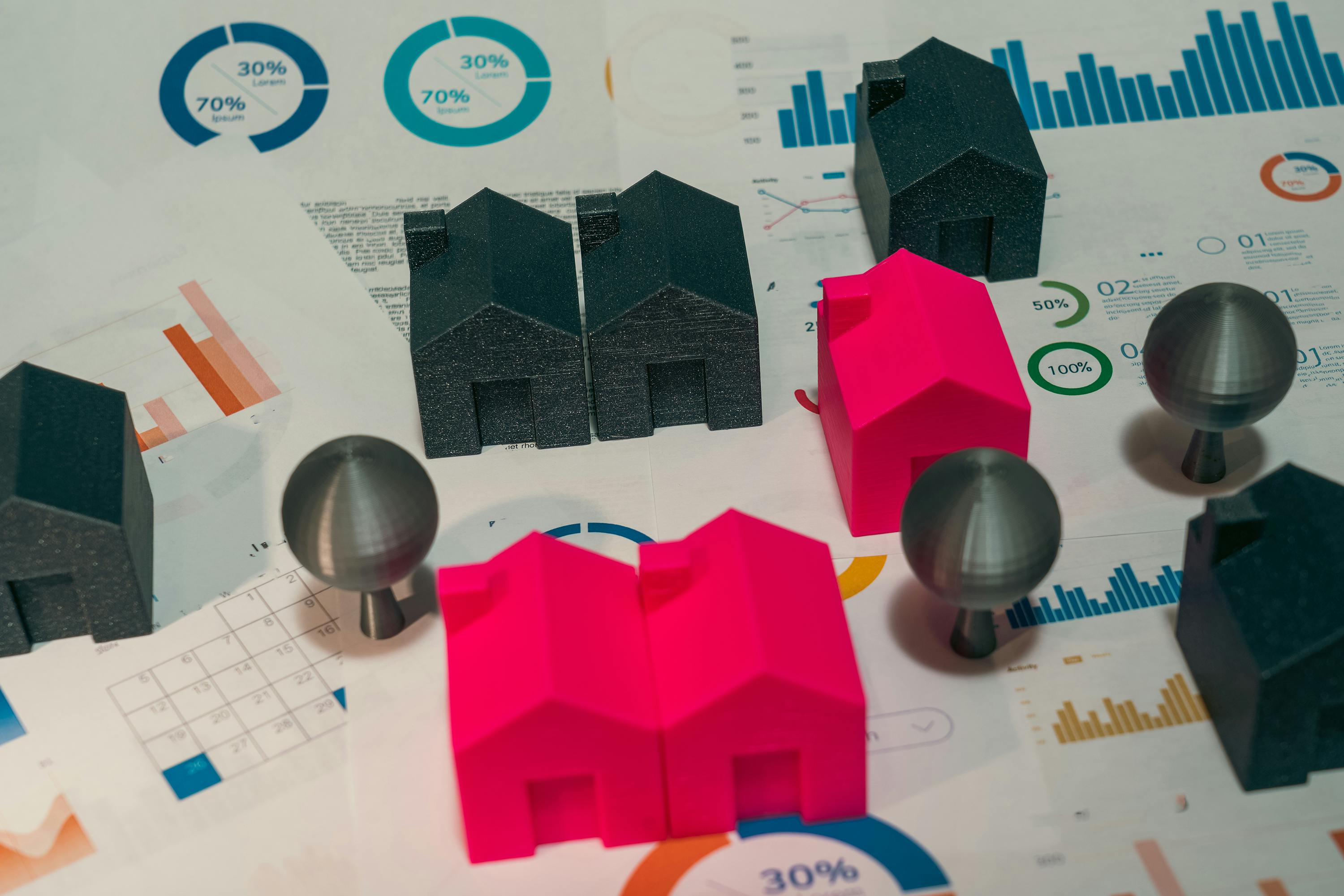 colorful model houses and paper charts